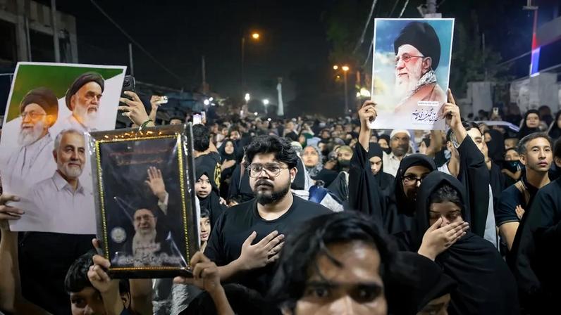 Shiite Muslims hold portraits of late Iranian Supreme Leader Ayatollah Ali Khamenei during a Matam procession in New Delhi, India, on March 10.
