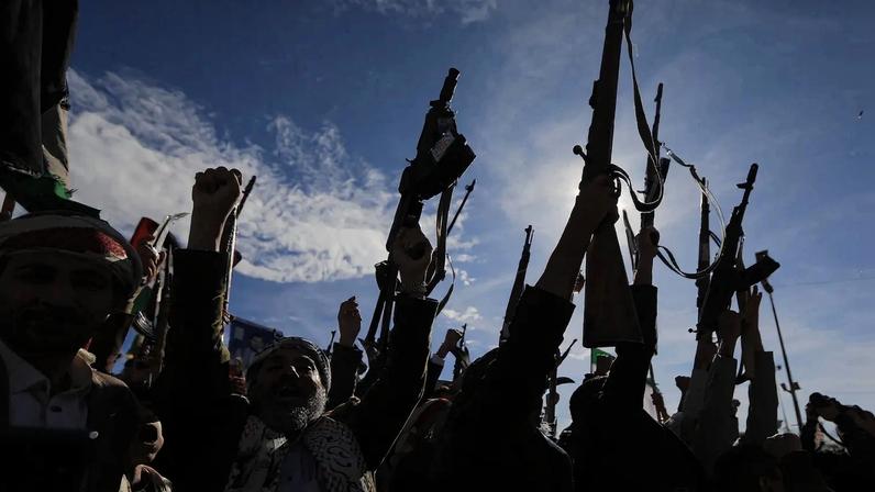 Houthis brandish their weapons as they rally in solidarity with Iran and Lebanon in the Yemeni capital Sanaa on March 27.