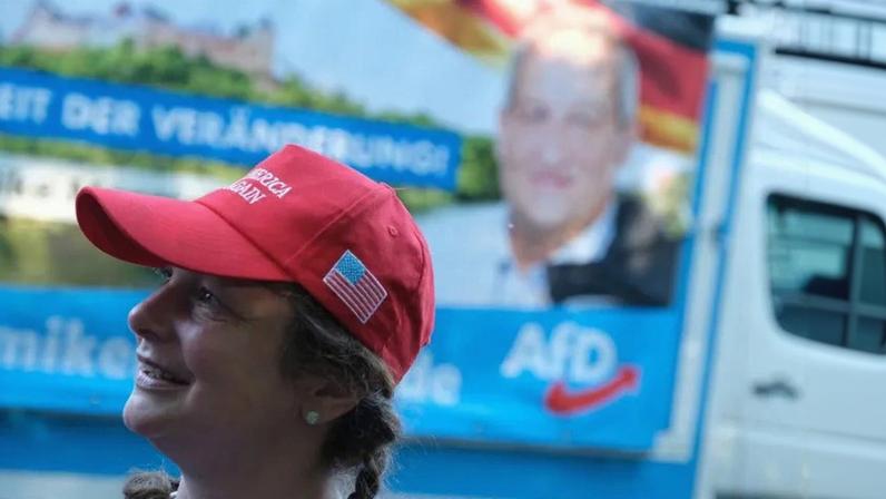 A woman wearing a "Make America Great Again" cap attends a campaign rally of the right-wing Alternative for Germany (AfD) in Görlitz, eastern Germany, on May 23, 2019.