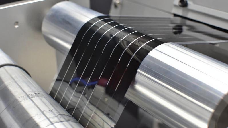 At Active Surfaces’ manufacturing development facility, the company tests and optimizes equipment for its first-of-its-kind commercial-scale manufacturing plant. Here, a solar energy film is fabricated in an industrial roll-to-roll printer — a device key to cost-effective mass production.