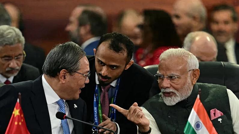 Chinese Premier Li Qiang talks with Indian Prime Minister Narendra Modi at the BRICS summit in Rio de Janeiro, Brazil, on July 7, 2025.