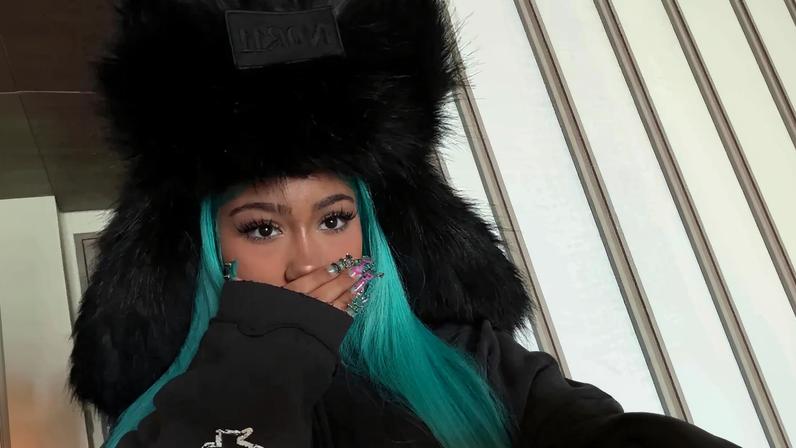 North West is seen above showing off her new manicure featuring piercings via Instagram Stories on Thursday.