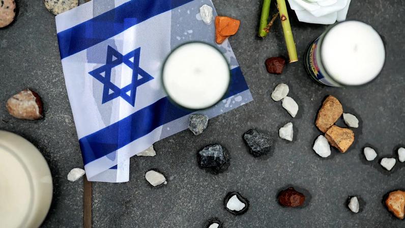 Stones, mementos and messages are left outside the Lillian and Albert Small Capital Jewish Museum on May 29, 2025 in Washington, DC.