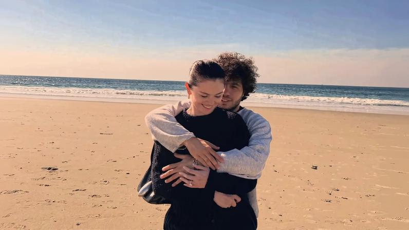 Selena Gomez and Benny Blanco cuddled on the beach in a new social media photo, seen above.