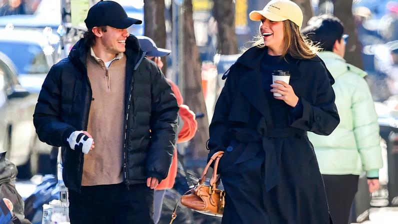 Tate McRae and NHL star Jack Hughes (pictured together in NYC in December 2025) are officially an item.
