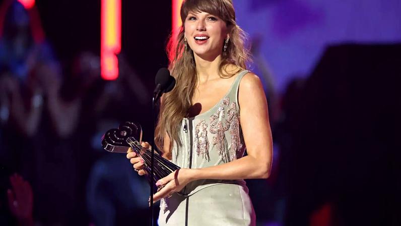 Taylor Swift accepts the Pop Album of the Year award at the 2026 iHeartRadio Music Awards