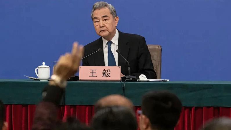 Chinese Foreign Minister Wang Yi looks on during a press conference in Beijing on March 8.