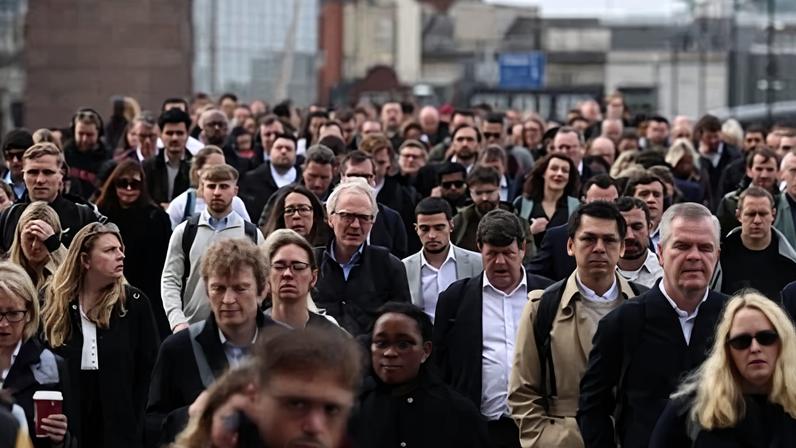 Workers cross London Bridge