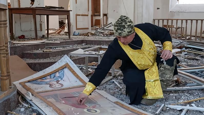 A Ukrainian military chaplain cleans up the Intercession of the Holy Mother of God church in preparation for Orthodox Easter in the frontline city of Orikhiv, Zaporizhzhia.