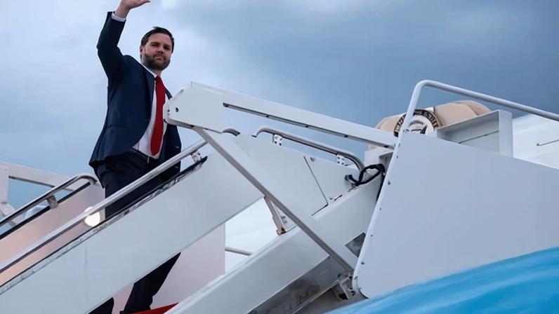 US vice-president JD Vance waves as he boards Air Force Two to depart for Budapest, at Joint Base Andrews, Md.