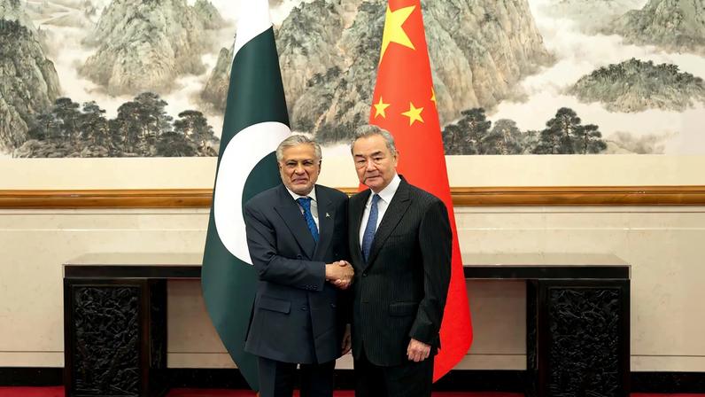 Chinese Foreign Minister Wang Yi shakes hands with Pakistani Foreign Minister Ishaq Dar in Beijing on March 31.