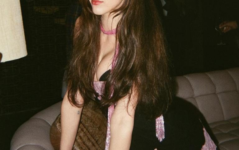 Margaret Qualley slipped into a vintage Betsey Johnson dress for Sabrina Carpenter’s new “House Tour” music video.