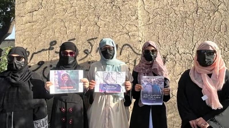 Women protesting against child marriage in Kabul in March. On the wall they have written: ‘We are the voice of the victims. No to child marriage.’