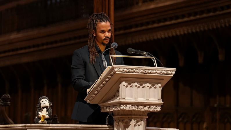Merlin Van Lawick speaking at Jane Goodall’s celebration of life in Washington, D.C., on Nov. 12, 2025. Image courtesy of Washington National Cathedral.