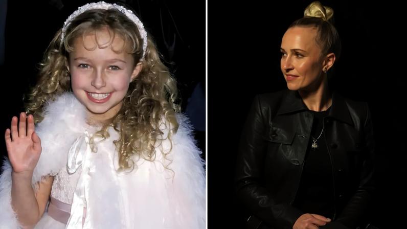 Hayden Panettiere in a white furry cape and dress, waving at the A Bug's Life premiere.