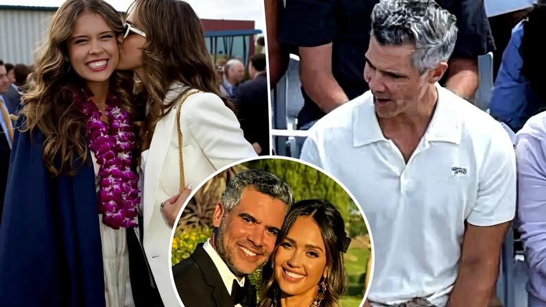 Jessica Alba recording the graduation with her phone while Cash Warren smiles, holding a camera.