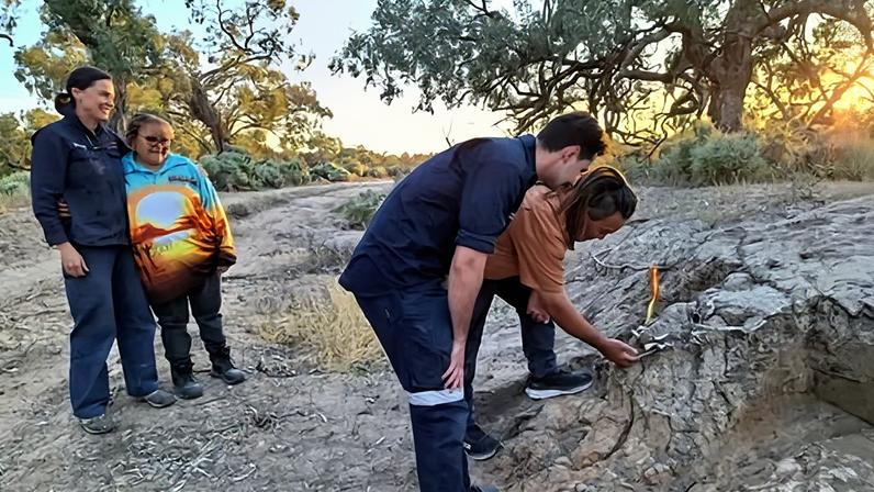 Barkindji custodian David Doyle lifts the first bone from a millennium-old dingo burial site in Kinchega national park. Dingoes ‘were a companion animal right up until colonisation’, he says.