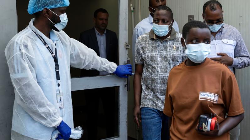 Bahati Erasto Musanga, provincial Governor walks with other officials, as they leave the Rodolphe Merieux Laboratory, North Kivu province, Democratic Republic of Congo, May 19, 2026.