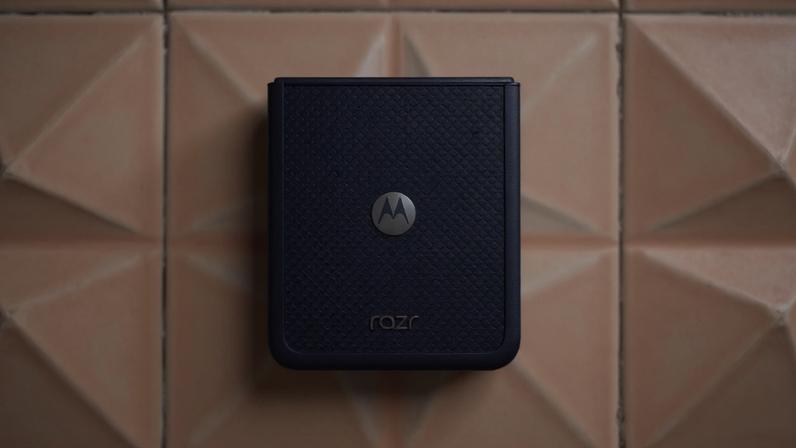 Motorola Razr Ultra 2026 on a tile surface showing blue color option