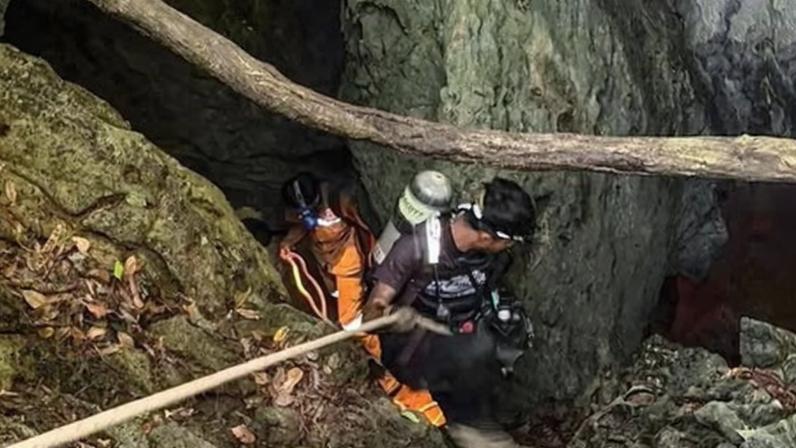Rescue workers inside the cave in Xaisomboun province, Laos, where seven people became trapped.