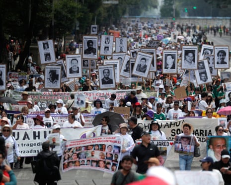 Relatives of missing people march in Mexico City on 10 May. Since 2010, at least 27 people who were looking for lost family members have been killed.