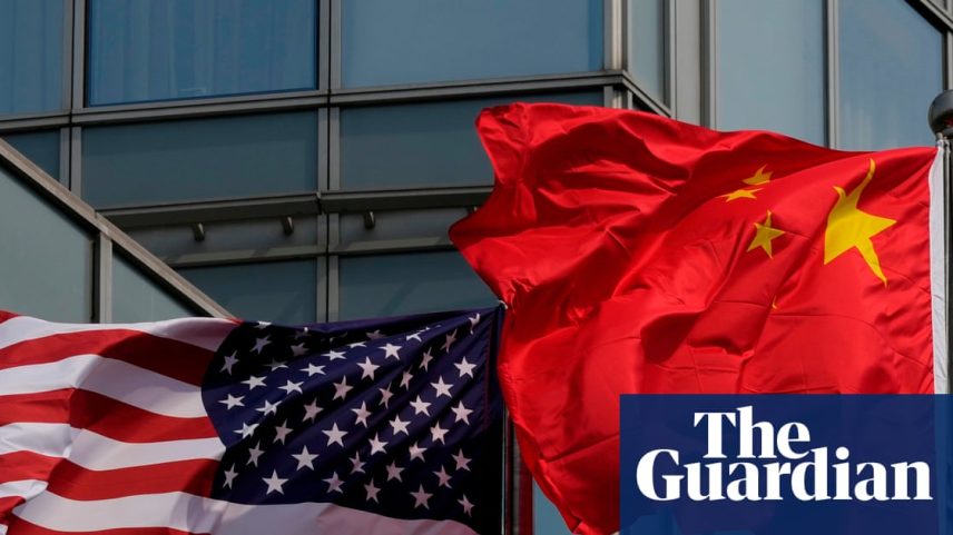 The US and Chinese flags flutter outside a hotel expected to be used for Donald Trump's visit to Beijing.