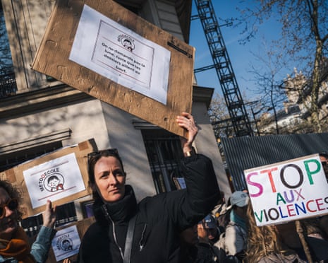 Mothers gather outside Paris city hall to protest against child sexual abuse by staff in schools and after-school care centres.