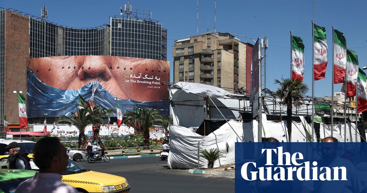A man tries to find respite from the extreme hot weather under the shade of a bush in Paris, as experts warn mankind has ‘permanently shifted the climate’. Photograph: Alice Sacco/Reuters