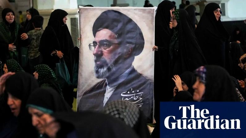Women gather around a portrait of Iran’s supreme leader, Ayatollah Mojtaba Khamenei, during a ceremony honouring the armed forces.