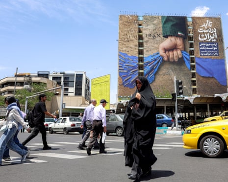 A billboard in Tehran represents the strait of Hormuz with the slogan ‘Forever in Iran’s hand’. Photograph: AFP/Getty Images