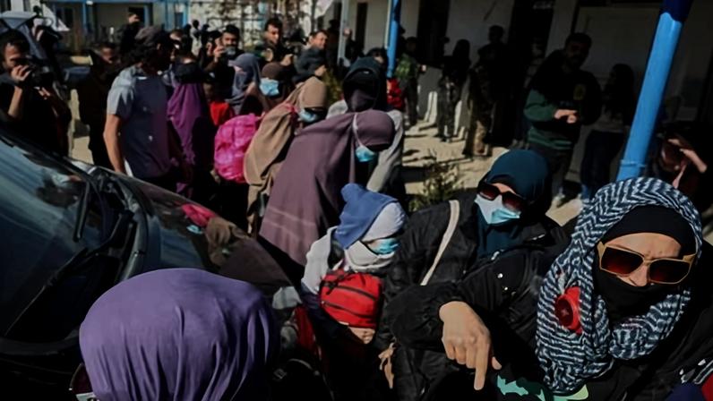 Family members of suspected Islamic State militants during a failed attempt to return to Australia from Syria in February. A group of seven women and 12 children are expected to arrive in Sydney and Melbourne on Tuesday afternoon.