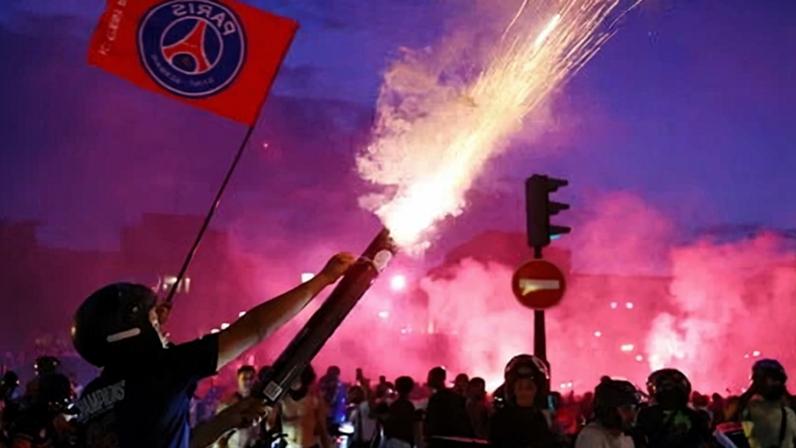 Paris Saint-Germain supporters let off fireworks and lit flares as they celebrates their team’s win in the French capital.