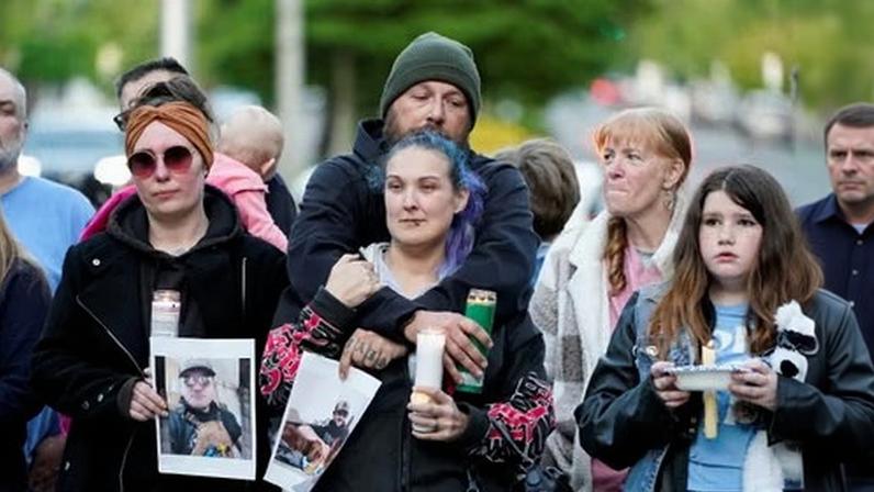 People attend a vigil after a chemical tank rupture at the Nippon Dynawave Packaging pulp and paper mill, in Longview, Washington, on Tuesday.