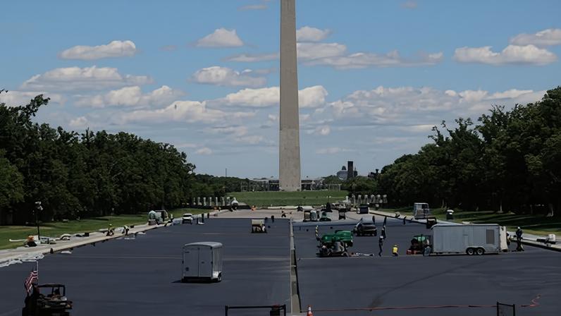 Workers apply a blue protective coating as part of a renovation project to the Lincoln Memorial reflecting pool in Washington DC on Friday.