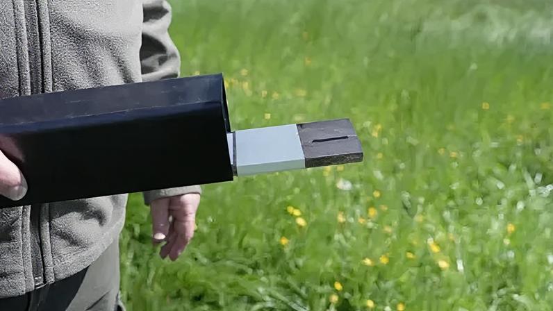 Volunteers use tunnels with paper and an ink-pad to monitor wildlife footprints