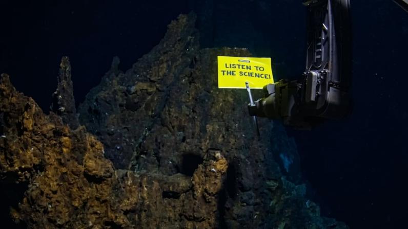 Banner image of ROV expedition led by Greenpeace International, Greenpeace Germany and Greenpeace Nordic. The ROV deploys an underwater robot and banner reading ‘Listen To The Science’ 2,300 meters below the surface near Loki’s Castle in the Arctic Ocean.