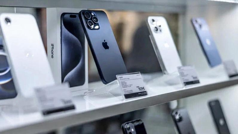 Prague Czech Republic - April 13. 2025: New Apple iPhones on shelf store. Showcase with smartphones in the electronics store.