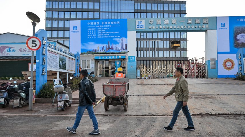 Construction workers are seen at the site of the new headquarters of the China Rare Earth Group in Ganzhou, located in eastern China’s Jiangxi province, on Nov. 21, 2025.