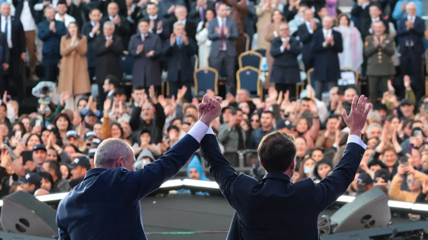 French President Emmanuel Macron and Armenian Prime Minister Nikol Pashinyan acknowledge the crowd after an event in Gyumri, Armenia, on May 5.