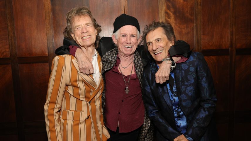 Mick Jagger, Keith Richards, and Ronnie Wood pose backstage in 2026