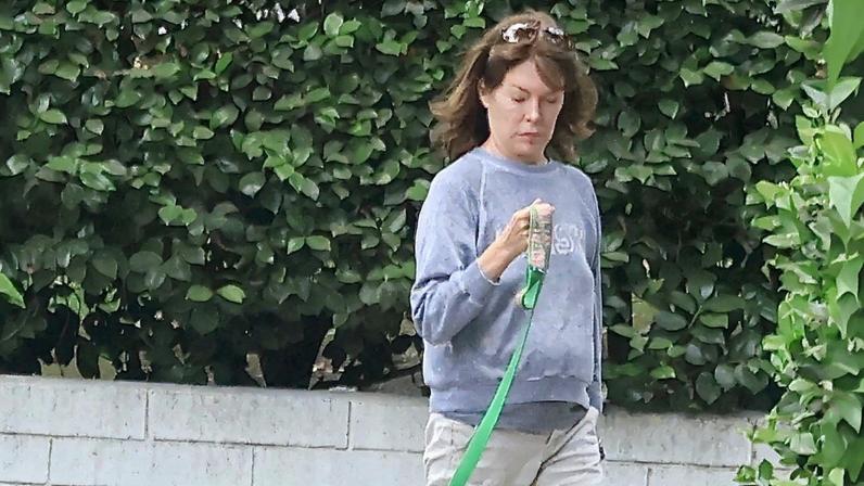 Lara Flynn Boyle (seen above with her dog) made a rare outing in LA.