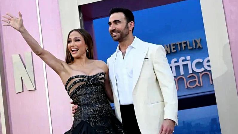 Jennifer Lopez and co-star Brett Goldstein attend the World Premiere of Netflix's "Office Romance."