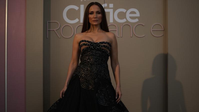 Jennifer Lopez posed in a black strapless gown with cutouts and lace detailing.