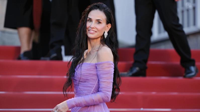 Demi Moore looked radiant in a sheer purple Gucci gown as she walked the red carpet for Day 2 of the 2026 Cannes Film Festival, as pictured above.