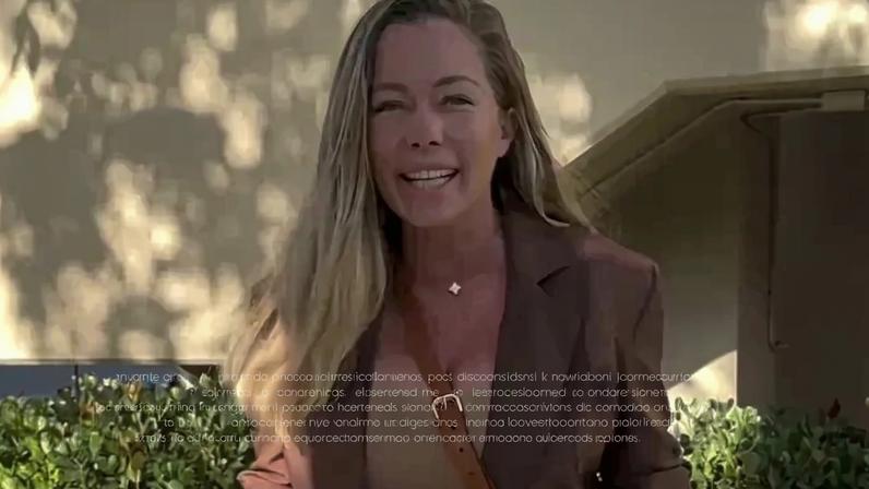 Kendra Wilkinson smiling at the camera.