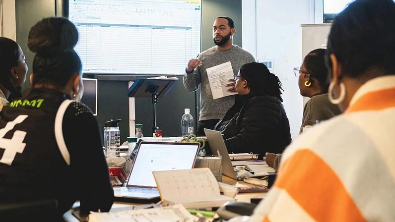 Chris Smith, a graduate of Corner to Corner's entrepreneurial training, teaches a cohort of aspiring business owners.