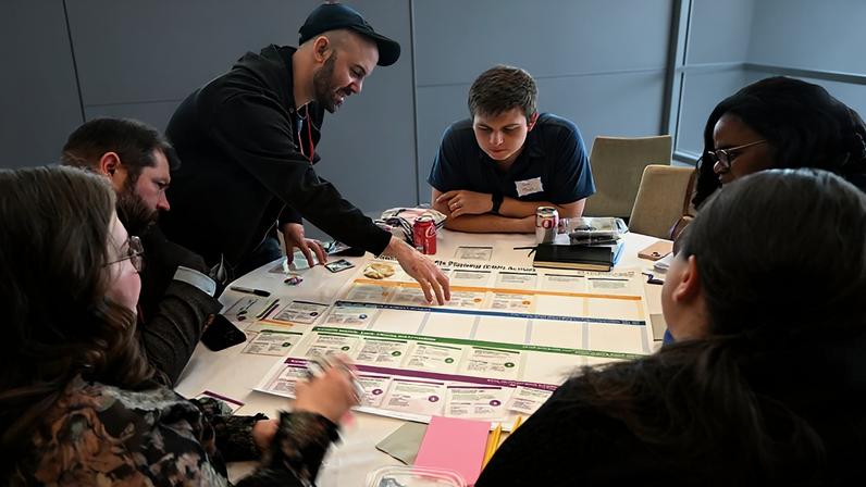 Living Climate Futures Symposium participants worked together to identify potential pros, cons, and trade-offs of allowing a data center to be built in a fictitious community.