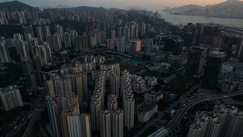 A dense high-rise development in Kowloon, Hong Kong, reflects the speed and scale of urbanization across the Asia-Pacific region, where cities are expanding rapidly to accommodate growing populations.