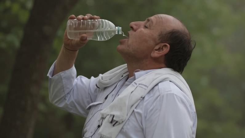 Man drinking from bottle of water