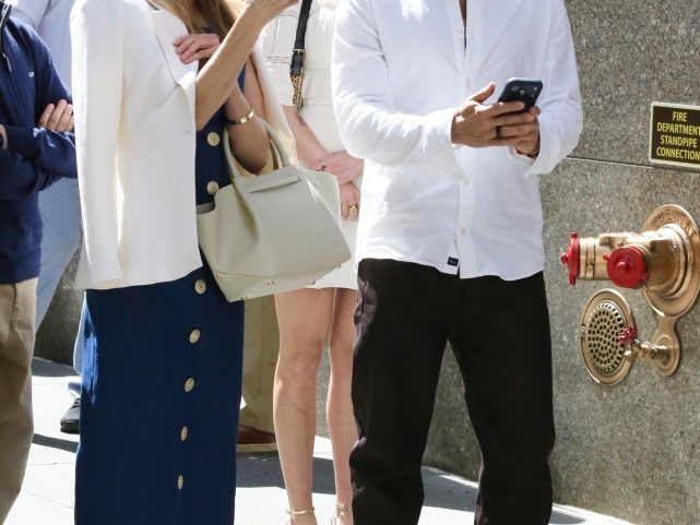 Reese Witherspoon and Ryan Phillippe were all smiles as they reunited for their son Deacon’s college graduation Friday (pictured above).